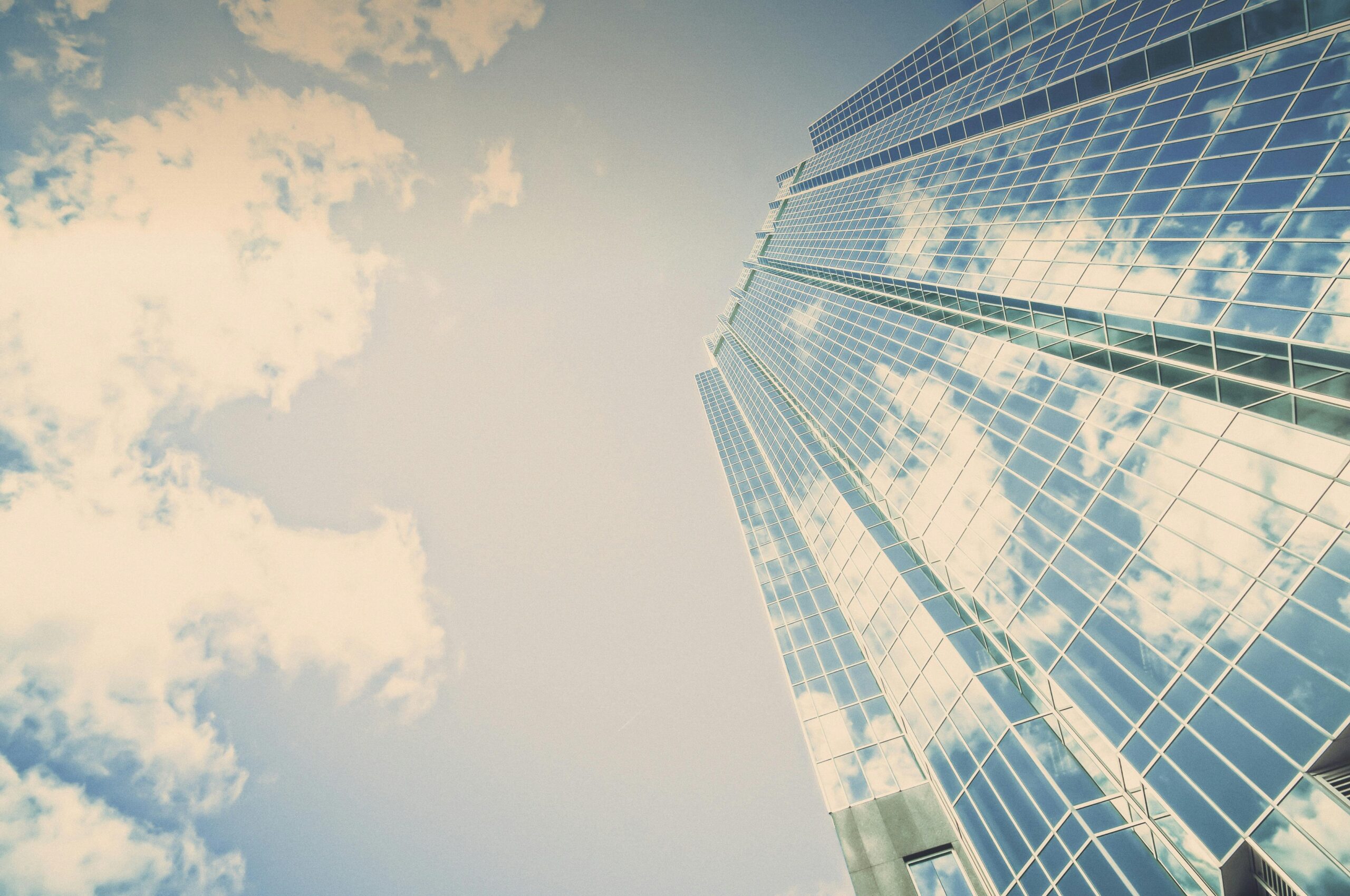 pexels-photo-27406-27406 A stunning skyscraper in London, Ontario reflecting clouds on its glass facade.